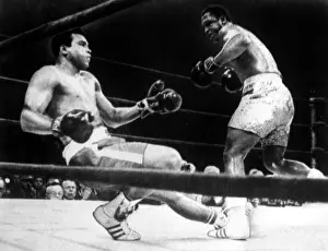 Muhammad Prints: Muhammad Ali knocked down by Joe Frazier in their first title match in Madison Square Garden