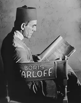 Script Prints: THE MUMMY, Boris Karloff reading the script on set, 1932