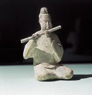 Zhonghua Prints: Musician Playing the Dizi. 618 - 907