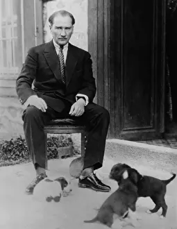 Mustafa Kemal Ataturk, President of Turkey, with his pet dogs, ca. 1930