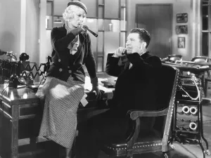 MYSTERY OF THE WAX MUSEUM, from left: Glenda Farrell, Frank McHugh, 1933