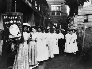 Sewing Prints: Nannie Burroughs holding emblem of Banner State Womans National Baptist Convention