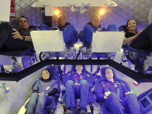Engineers Prints: NASA astronauts and industry experts check out the crew accommodations in the Dragon spacecraft under development by