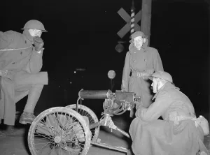 Michigan Prints: National Guard with machine gun overlooking GM factories. 1937