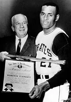 Champion Prints: National League President Warren Giles presents batting champion Roberto Clemente of the Pittsburgh Pirates with a