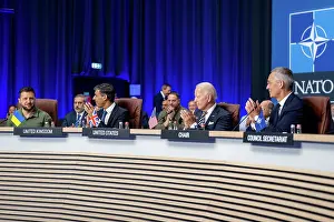 Amphitheater Prints: NATO-Ukraine Council of the NATO Summit meets at the distant circular table in the large interior space
