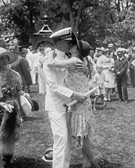 20 25 People Prints: Navy Ensign Clyde Roberts kissing Ann Tardy after commencement exercises at Annapolis
