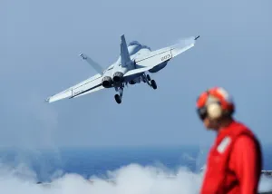 Aircraft Carriers Prints: US Navy F-18 Hornet aircraft launches from the aircraft carrier USS Abraham Lincoln in the Gulf of Oman