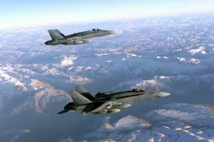 Smart Bombs Prints: Two Navy F-18 Hornet fighters patrol the skies over Afghanistan's mountainous landscape during the first months of