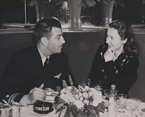 Actresses Prints: Navy Lieutenant Robert Taylor, with his wife