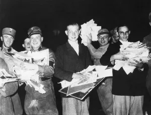 Young Men Prints: Nazi Storm troopers and young German men holding pictures and pamphlets at public book burning