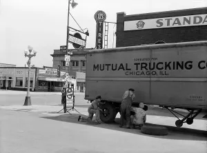 Nebraska Prints: Nebraska, changing a tire on a trailer truck