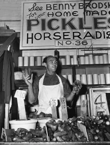 Vegetables Prints: New York City, Benny Brodsky, pushcart vendor, at his stand, photograph, 1940