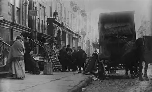 Dwellings Prints: New York City family being evicted from their tenement apartment, c. 1905-10