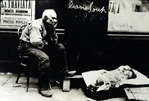 Hine Prints: NEW YORK CITY, an immigrant and his baby on the streets of the Lower East Side in 1907