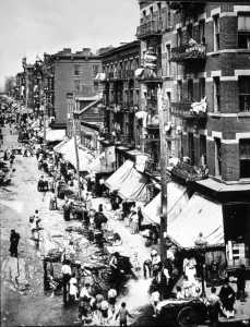 NEW YORK CITY, Immigrants on the summer streets of the Lower East Side, early 1900's.. Courtesy: CSU Archives / Everett Collection