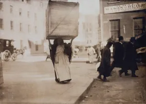 Lifting Prints: New York City, Italian woman carrying an enormous empty dry-goods box for along Bleeker Street