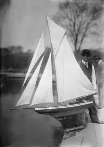Central Park Prints: New York City, man with toy yacht in Central Park, circa 1910s