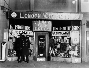 Courts Prints: A New York City policeman guarding the crime scene where gangster Vincent Coll was murdered by Dutch Schultz's