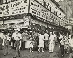 Lcgr1409 Prints: New York City street corner with customers ordering and eating Nathan's Hot Dogs