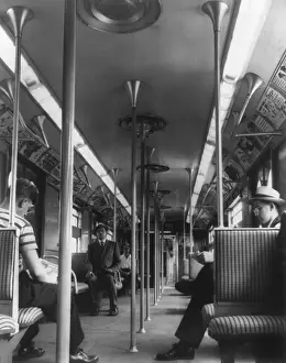 Seats Prints: New York City subway car interior with fluorescent lighting