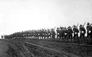 December Prints: New York National Guard, silhouetted against the sky as they march to the training camp