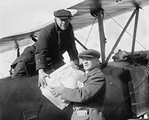 Aeroplane Prints: New York Times is loaded into an Air Mail Service plane in 1921 (BSLOC_2016_10_157)