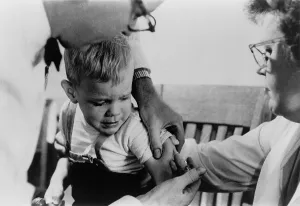 Nurses Prints: Newly available measles vaccine shot is given to a young boy in Upper Darby