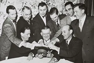 Bell Prints: NFL owners gather around Commissioner Bert Bell for the annual bonus draft, Jan. 18, 1951