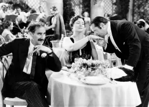 Kissing Hand Prints: A NIGHT AT THE OPERA, from left, Groucho Marx, Margaret Dumont, Sig Ruman, 1935