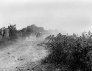 Tanks Prints: Along a Norman hedgerow, U.S. soldiers fire anti-tank weapons at the Germans
