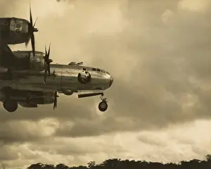 Bombers Prints: Nose of a B-29 bomber coming in for a landing at a field in Guam in 1945