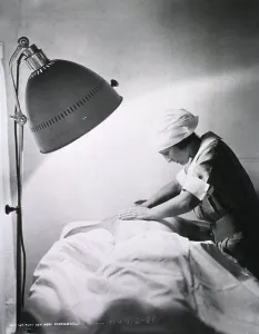 Patients Prints: Nurse giving back rub to a patient in Walter Reed General Hospital. 1922