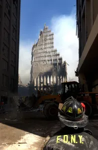 Skyscraper Prints: NYC fireman looks up at what remains of the North Tower of the WTC after its collapse