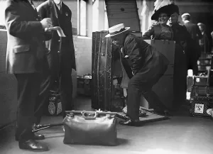 Customs Prints: Ocean liner passenger struggling thorough a Customs inspection at the Norddeutscher Lloyd pier in New York City