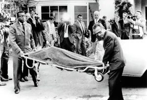 Reporters Prints: Officials carrying the body of Mickey Rooney's estranged wife