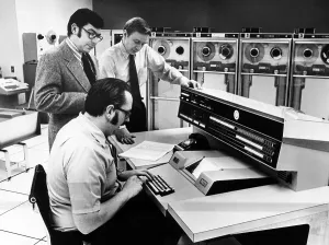 Computer Prints: Officials at the main console of Univac 1108