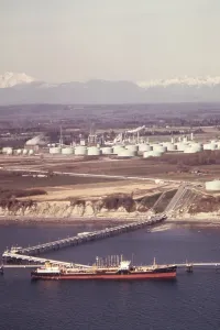 Washington State Prints: Oil Tanker off loading its liquid cargo at Cherry Point on Puget Sound. Ca. 1973-75