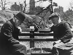 Spring Prints: Two old-timers playing chess on a Central Park bench in New York City