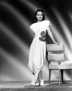 Grecian Prints: Olivia De Havilland in a harem-type draped dinner dress, 1946
