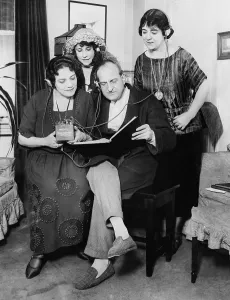 Broadcasting Prints: Opera stars read score of Tosca while listening to the opera via radio headphones