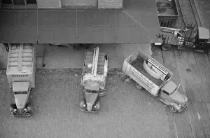 Trucks Prints: Overhead view of trucks loading at farm implement warehouse, Minneapolis, Minnesota, 1939