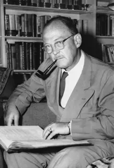 Owen Prints: Owen Lattimore, Far Eastern scholar, in the library of his Baltimore home. July 9, 1954