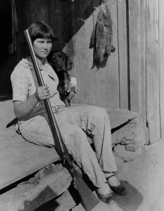 Pants Prints: Ozark farmer's daughter holding double barrel shotgun