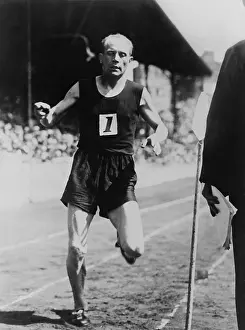 Informal Prints: Paavo Nurmi, winning the six-mile race at the international track meet at Stamford Bridge