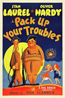 Hardy Prints: PACK UP YOUR TROUBLES, from left: Stan Laurel, Oliver Hardy on 1940s poster art, 1932