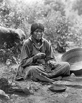 Crafts Prints: A Paiute woman weaves a basket