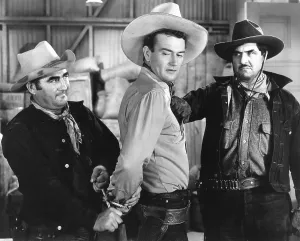 Handcuffed Prints: PALS OF THE SADDLE, from left, Curley Dresden, John Wayne, Olin Francis, 1938
