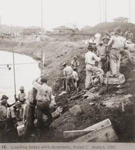 Excavation Prints: Panama Canal construction showing workers loading holes with dynamite