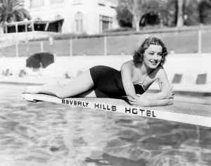 Swimming Pool Prints: Paramount starlet Ellen Drew, sunbathing at the Beverly Hills Hotel, 1939